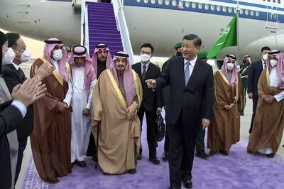 A picture taken from footage aired by Saudi TV shows China's President Xi Jinping being received by officials including the Governor of Riyadh province Prince Faisal bin Bandar Al Saud at King Khalid International Airport in Riyadh. AFP