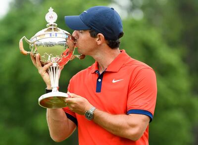 Rory McIlroy, of Northern Ireland, kisses the trophy after winning the Canadian Open golf championship in Ancaster, Ontario, Sunday, June 9, 2019. (Nathan Denette/The Canadian Press via AP)