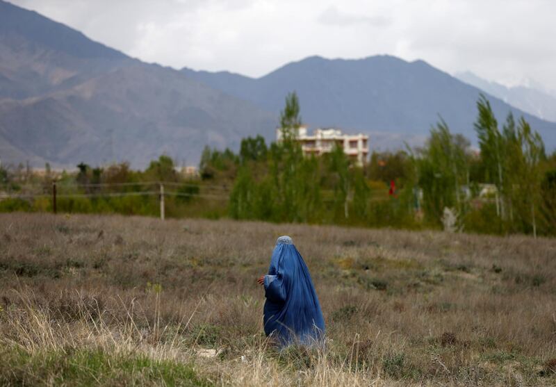 A woman walks on the outskirts of Kabul. Reuters
