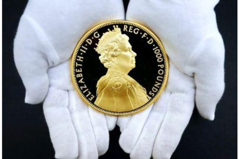 A gold coin commemorating the 60th anniversary of the coronation of Britain's Queen Elizabeth II. Luke MacGregor / Reuters
