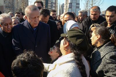 Turkish President Recep Tayyip Erdogan talks with women during his visit to the hard-hit south-eastern Turkish city of Diyarbakir last week. AFP