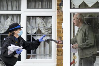 MAIDSTONE, ENGLAND - FEBRUARY 03: Volunteers from various emergency services and council members go door-to-door to distribute Covid-19 tests to residents homes on February 03, 2021 in Maidstone, United Kingdom. Health authorities have found more than 100 cases of a coronavirus variant first identified in South Africa,  prompting a scramble to deploy new testing initiatives across eight areas in England. It is thought the variant is more contagious, but not more deadly, than the variant that has predominated in England throughout the covid-19 pandemic. (Photo by Dan Kitwood/Getty Images)