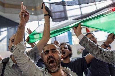 Egyptian journalists chant slogans against Israel and the US during a protest in solidarity with Palestinians at the headquarters of the Syndicate of Journalists in Cairo on October 11, 2023. AFP