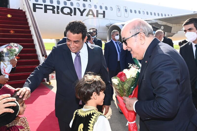 Mr Tebboune, right, receives Mohamed Al Menfi, President of the Libyan Presidential Council. EPA