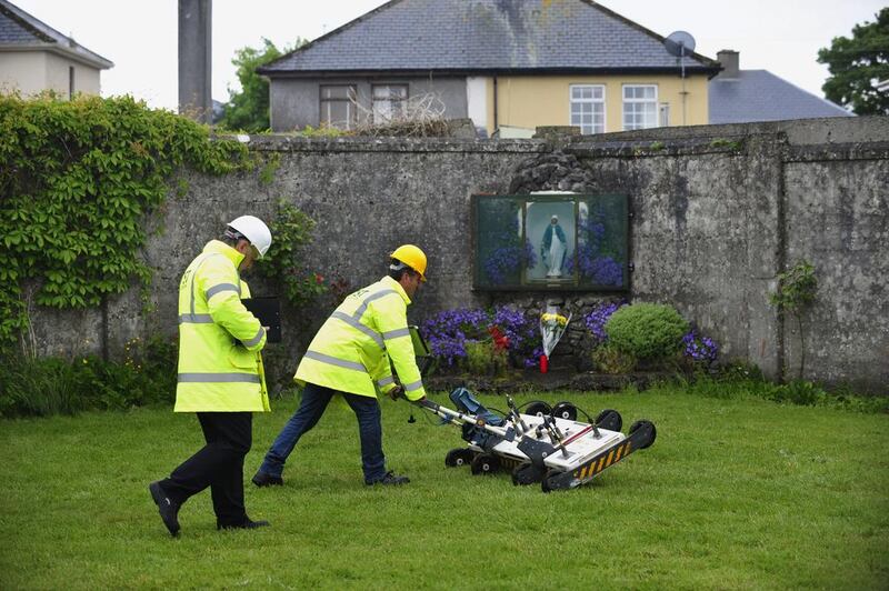 Engineers use ground-penetrating radar at the site of a mass grave of up to nearly 800 children at the former Bon Secours Mother and Baby Home in Tuam, western Ireland, on June 6, 2014. Aidan Crawley / EPA 