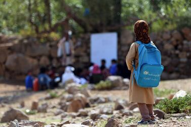 Yemeni school children attend an open-air class under a tree near their unfinished school on September 16, 2019 in the southwestern Yemeni village of Al Kashar in Taez governorate's Mashraa and Hadnan district at the start of the new academic year in the war battered country. AFP