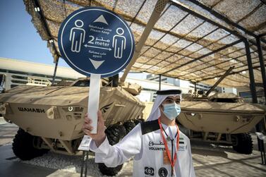 A social-distancing sign at Idex 2021. Local and international companies showcased new products on the second day of the defence exhibition. Victor Besa / The National  