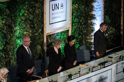 People have a moment of silence for the victims, including 19 UN workers, of Ethiopia Airline's crash before the 4th UN Environment Assembly at the UN headquaters in Nairobi, Kenya, on March 11, 2019.  / AFP / Yasuyoshi CHIBA
