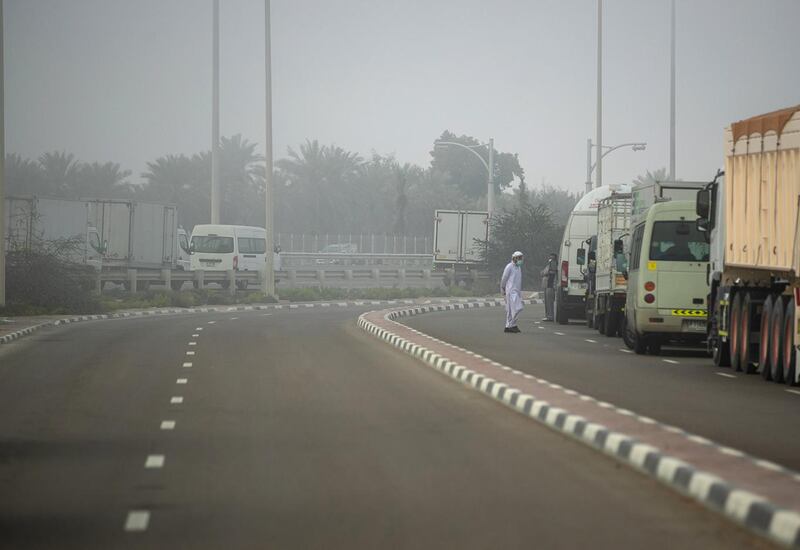 Abu Dhabi, United Arab Emirates, March 4, 2021.  Foggy morning at Abu Dhabi.  Trucks and large vehicles pull to the side of the E10 highway for sfety reasons during fog.
Victor Besa / The National
Section:  NA