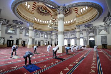 Midday prayers are performed at Al Farooq Omar bin Al Khattab Mosque in Dubai in July. Chris Whiteoak / The National  
