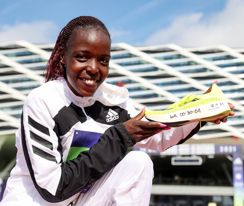 Agnes Tirop of Kenya poses with the ADIZERO adios Pro 1 shoe after winning the ADIZERO: ROAD TO RECORDS Women's 10km in 30:01 at adidas HQ on September 12, 2021 in Herzogenaurach, Germany. She broke the world record by 29 seconds. Getty Images