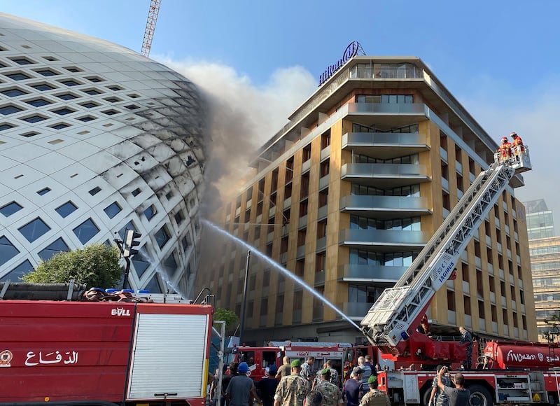 Videos on social media showed firefighters attempting to extinguish the flames as smoke billowed from the building and over the Hilton hotel next door. AP Photo