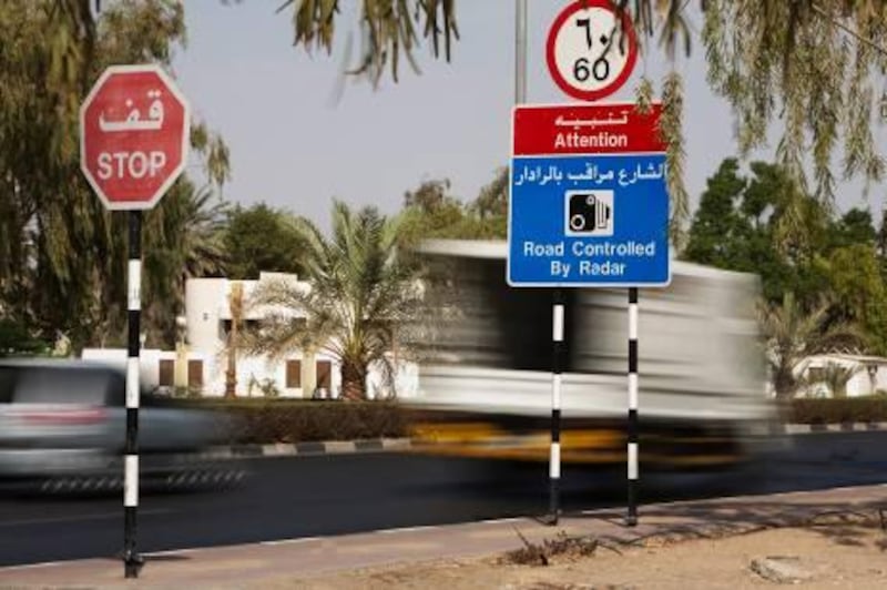 24/09/2009 - Al Ain, UAE - Cars speed on Shakboot Ibn Sultan St. in Al Ain even though there is clear warnings that the road uses radar.  Within the city limits, Al Ain has a 60 km an hour speed limit, which is often ignored by motorists.  (Andrew Henderson/The National) *** Local Caption ***  ah_090924_Al_Ain_Speeding_0200.jpg