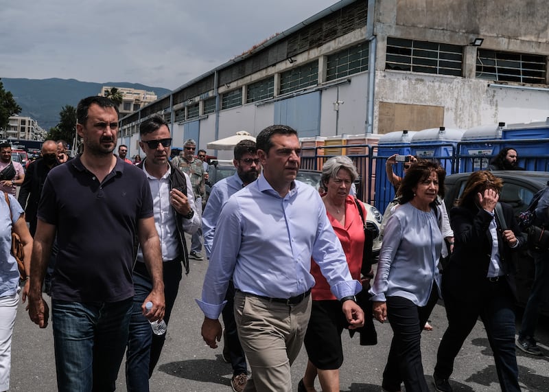 Former prime minister Alexis Tsipras, currently running for office again, arrives at the port. Getty Images