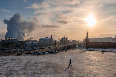 A man walks on Vasilyevsky Spusk (The Basil's Downhill) at the Kremlin during a frosty day, with temperature lows at around -21 ° Celsius, in Moscow, on December 22. AFP