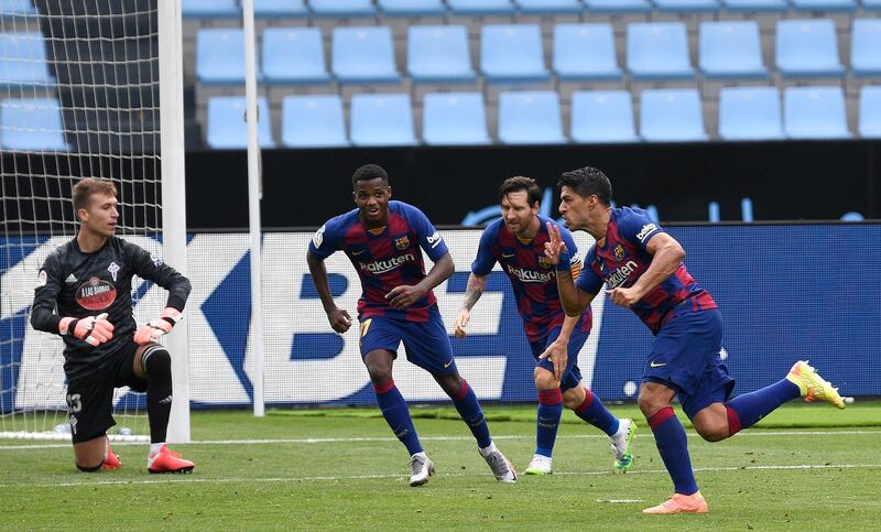 Luis Suarez, right, celebrates scoring his second goal. Getty