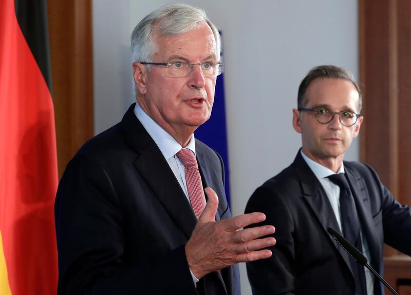 German Foreign Minister Heiko Maas, right, and the European Union chief Brexit negotiator, Michel Barnier, left, address the media during a joint press conference as part of a meeting at the Foreign Ministry in Berlin, Germany, Wednesday, Aug. 29, 2018. (AP Photo/Michael Sohn)