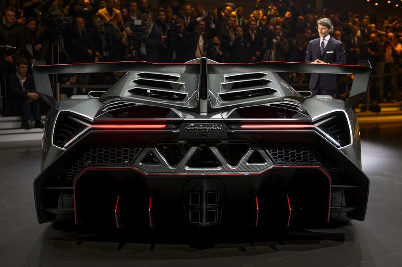 The new Lamborghini Veneno is presented by CEO and Chairman Stephan Winkelmann during a preview of Volkswagen Group on March 4, 2013 ahead of the Geneva Car Show in Geneva. AFP PHOTO / FABRICE COFFRINI
 *** Local Caption ***  620605-01-08.jpg