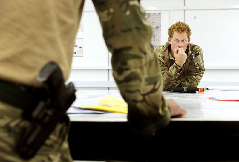 Britain's Prince Harry attends a mission briefing in the British controlled flight-line in Camp Bastion southern Afghanistan in this photograph taken October 31, 2012, and released January 22, 2013. The Prince, who is serving as a pilot/gunner with 662 Squadron Army Air Corps, is on a posting to Afghanistan that runs from September 2012  to January 2013.  Photograph taken October 31, 2012.     REUTERS/John Stillwell/Pool  (AFGHANISTAN - Tags: MILITARY POLITICS SOCIETY ROYALS CONFLICT) *** Local Caption ***  LON008_BRITAIN-HARR_0122_11.JPG