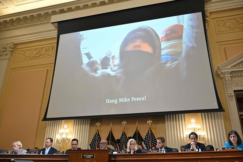 Images of the attack on the US Capitol were projected as the committee began its third day of hearings. AFP