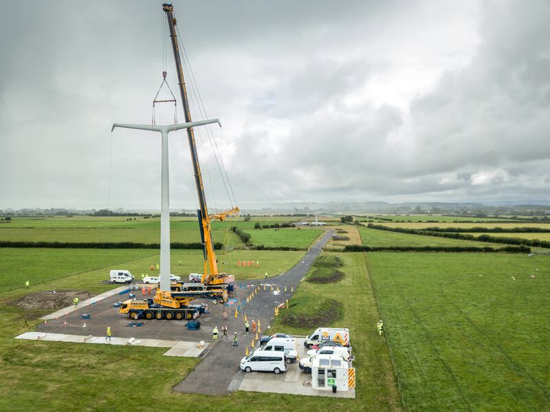 A new T-pylon being installed in Somerset, England. PA.