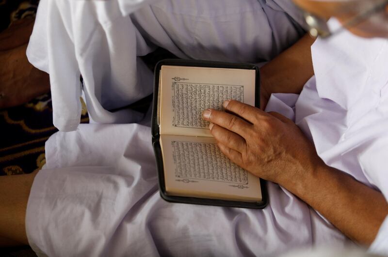 A Muslim reads the Koran during Friday prayers at the Grand mosque ahead of the annual Haj pilgrimage, in Mecca, Saudi Arabia August 25, 2017. REUTERS/Suhaib Salem