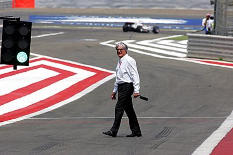 Bernie Ecclestone crosses the pitlane at the Bahrain Grand Prix in 2006. The May 1 deadline on whether Bahrain hosts a grand prix may be put back further.