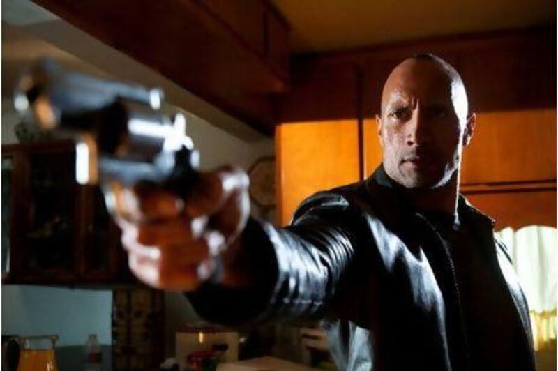 Dwayne Johnson stars as the gun-toting hard man in faster. Courtesy CBS Films, Inc