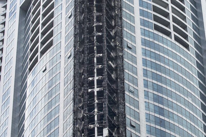 The charred aftermath of The Torch at Dubai Marina where a fire broke out.  Reem Mohammed / The National