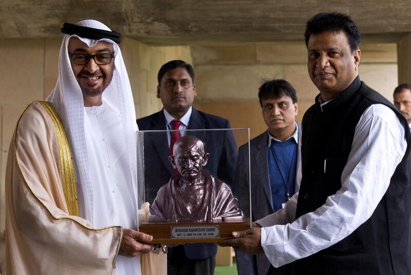 Abu Dhabi Crown Prince Sheikh Mohammed bin Zayed is presented with a bust of Mahatma Gandhi by Samadhi Committee Secretary Rajnish Kumar as he visits a memorial to the Mahatma in New Delhi. Saurabh Das / AP Photo