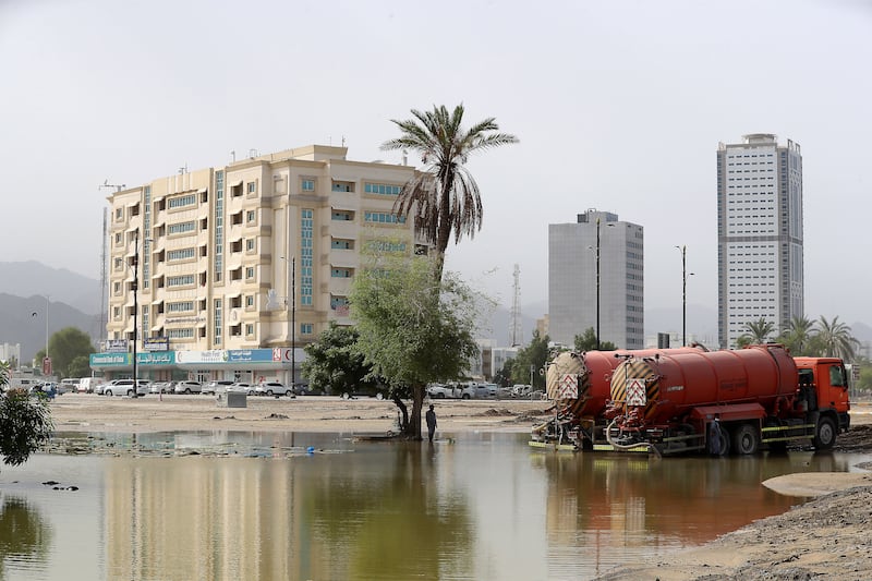 Tankers clear the waterlogged area around a mosque near the corniche after last week's flash floods in Fujairah. 
