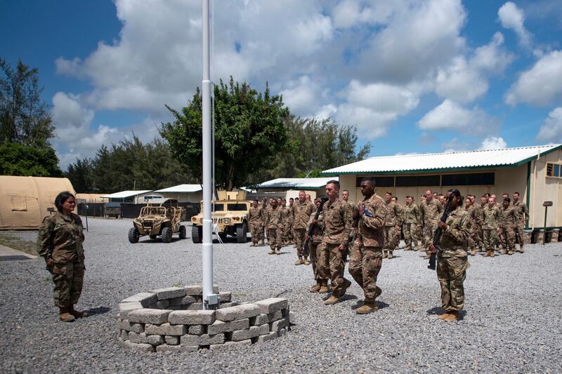 US Air Force personnel conduct a flag-raising ceremony at Camp Simba in Lamu, Kenya, in August 2019. EPA