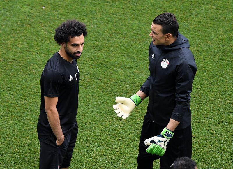Mohamed Salah, left, talks with Egypt's goalkeeper Essam El Hadary during training at the Volgograd Arena. AFP