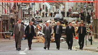 Northern Irish officials walk among the rubble in a street in Omagh in August 1998, shortly after a car bomb explosion that killed 28 and injured hundreds. AFP