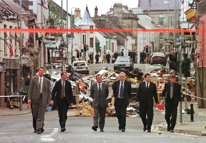 Northern Irish officials walk among the rubble in a street in Omagh in August 1998, shortly after a car bomb explosion that killed 28 and injured hundreds. AFP
