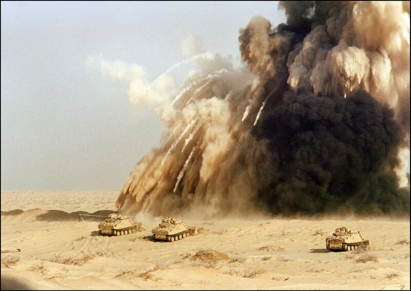 (FILES) British engineers from the 7th armoured brigade bow up a mine shield 07 January 1991 in Saudi Arabian desert. The British tanks, cavalry and artilleries' goal was to take over an Iraqi position surrounded by obstacles and mines. Iraq's invasion of Kuwait 02 August 1990, ostensibly over violations of the Iraqi border, led to the Gulf War which began 16 January 1991. A US-led multi-national force repulsed Iraq from Kuwait and a cease-fire was signed 28 February 1991. (Photo by PATRICK BAZ / AFP)