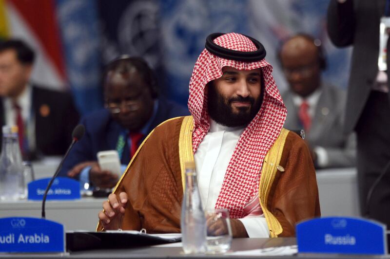 In this photo released by the press office of the G20 Summit Saudi Arabia's Crown Prince Mohammed bin Salman attends a plenary session on the second day of the G20 Leader's Summit in Buenos Aires, Argentina, Saturday, Dec. 1, 2018. (G20 Press Office via AP)