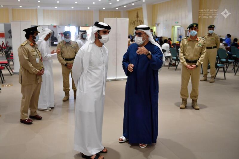 Sheikh Mansoor bin Mohammed, chairman of the emirate's Supreme Committee of Crisis and Disaster Management, visits a Covid-19 vaccination centre in Dubai on Sunday. Courtesy: Dubai Media Office