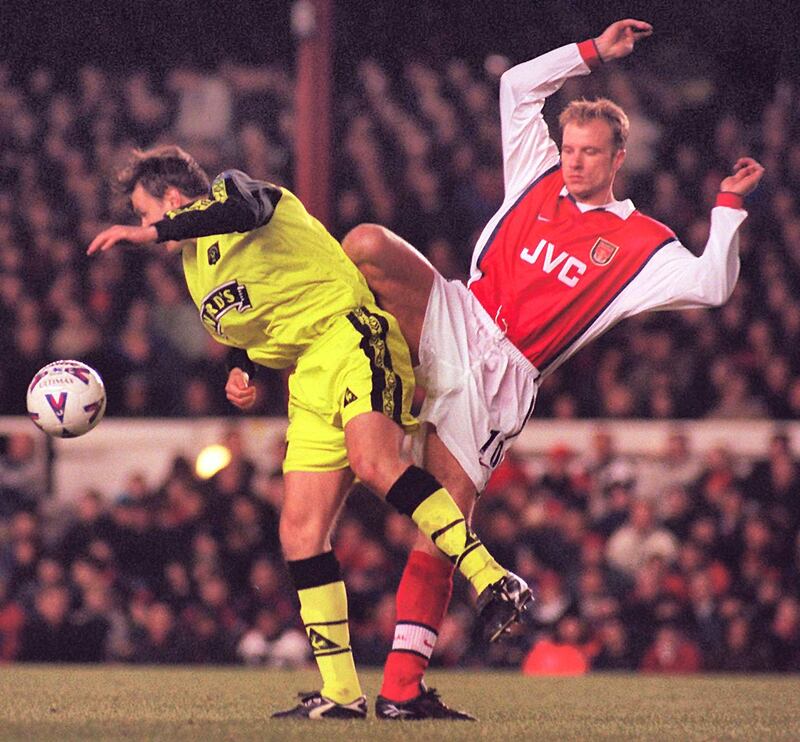 This picture can only be used within the context of an editorial feature. Arsenal's Dennis Bergkamp (right) and Sheffield United's Lee Sandford during the rematch of the FA Cup 5th round tie at Highbury. Final Score: Arsenal 2  Sheffield Utd 1.   (Photo by Tony Harris - PA Images/PA Images via Getty Images)