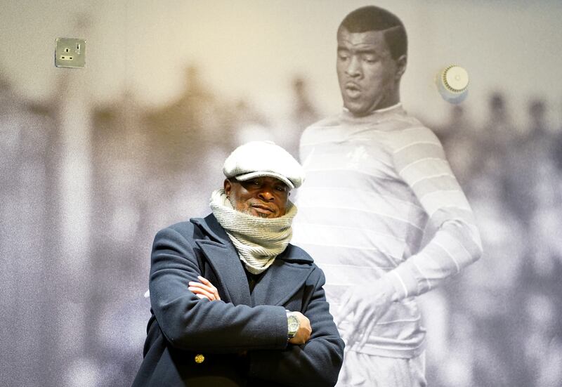 Chelsea's first Black player, Paul Canoville, in front of a photograph of his in his playing days, in London on November 28, 2021.