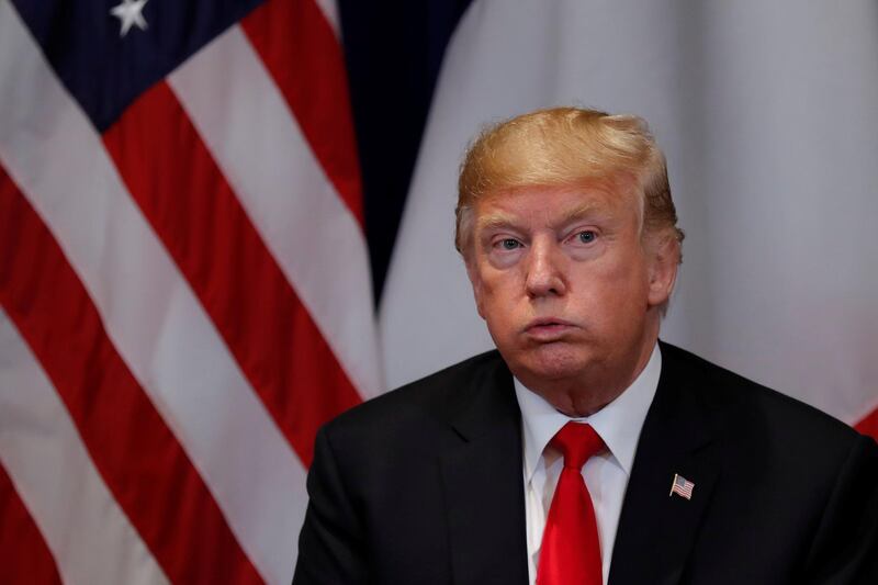 US President Donald Trump reacts during a bilateral meeting with France's President Emmanuel Macron. Reuters