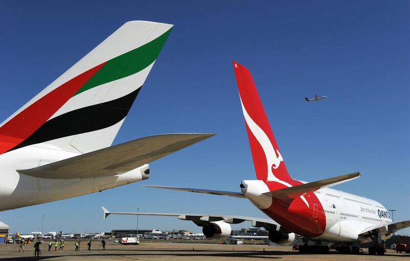 Emirates Airline is partnered with Qantas. AFP PHOTO / Greg WOOD