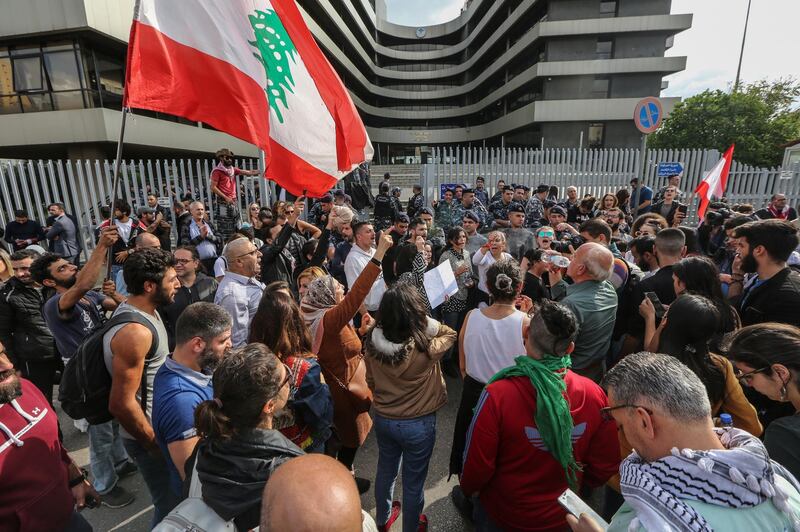 Lebanese anti-government protesters shout slogans during a protest outside of the Lebanese TVA building referring to the worsening economic situation, at Adlyeh area in Beirut, Lebanon.  EPA