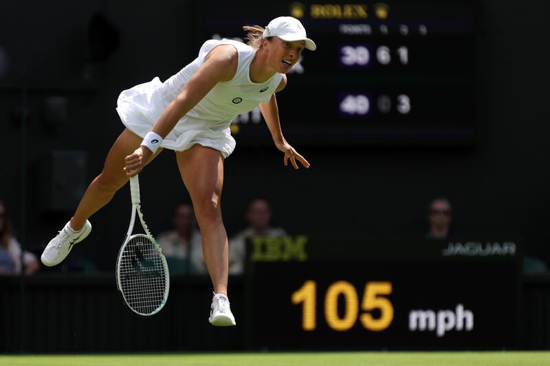 Iga Swiatek serves during her first-round win at Wimbledon. Getty