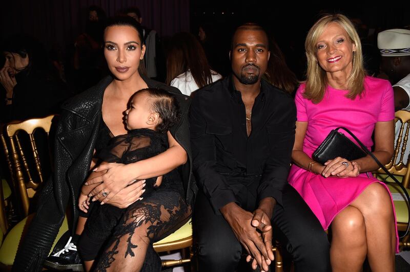 PARIS, FRANCE - SEPTEMBER 28:  (L-R) Kim Kardashian, baby North West, Kanye West and Helene Arnault attend the Givenchy show as part of the Paris Fashion Week Womenswear Spring/Summer 2015 on September 28, 2014 in Paris, France.  (Photo by Pascal Le Segretain/Getty Images)