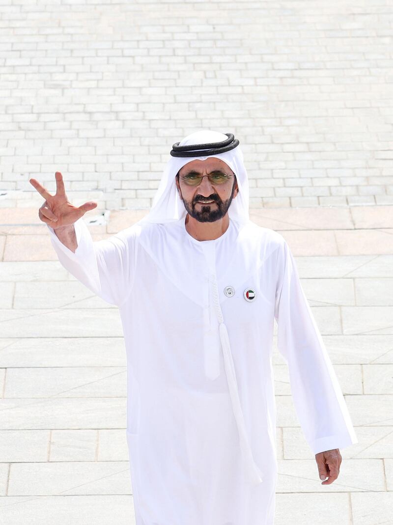 Mohammed bin Rashid raises the flag of the UAE in the Union House. WAM