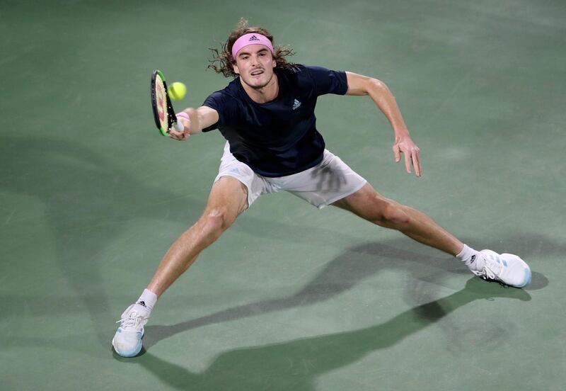 Tsitsipas stretches for a shot. Reuters