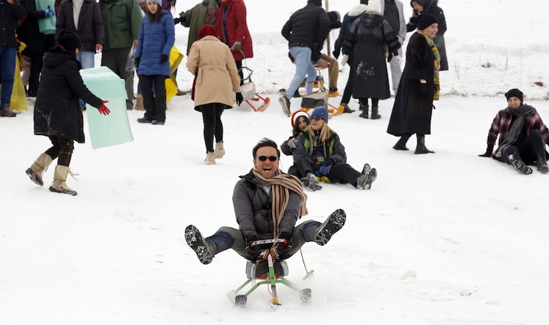 Iranians enjoy sledding at Abali Ski Resort north-east of Tehran. Unusually cold weather swept across the country last week, disrupting normal life. EPA