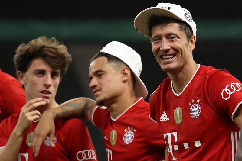 Alvaro Odriozola, Philippe Coutinho and Robert Lewandowski of Bayern Munich celebrate winning the cup final. EPA