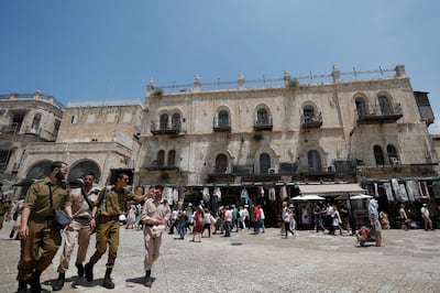 Israeli soldiers outside the Petra Hotel, a Greek Orthodox Church property, near the Jaffa Gate in Jerusalem's Old City. EPA